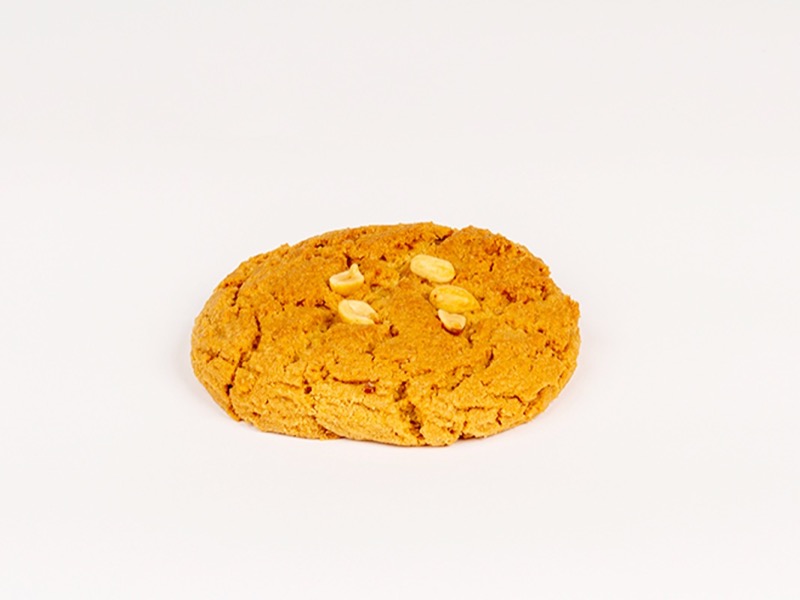 A peanut butter cookie topped with peanuts
